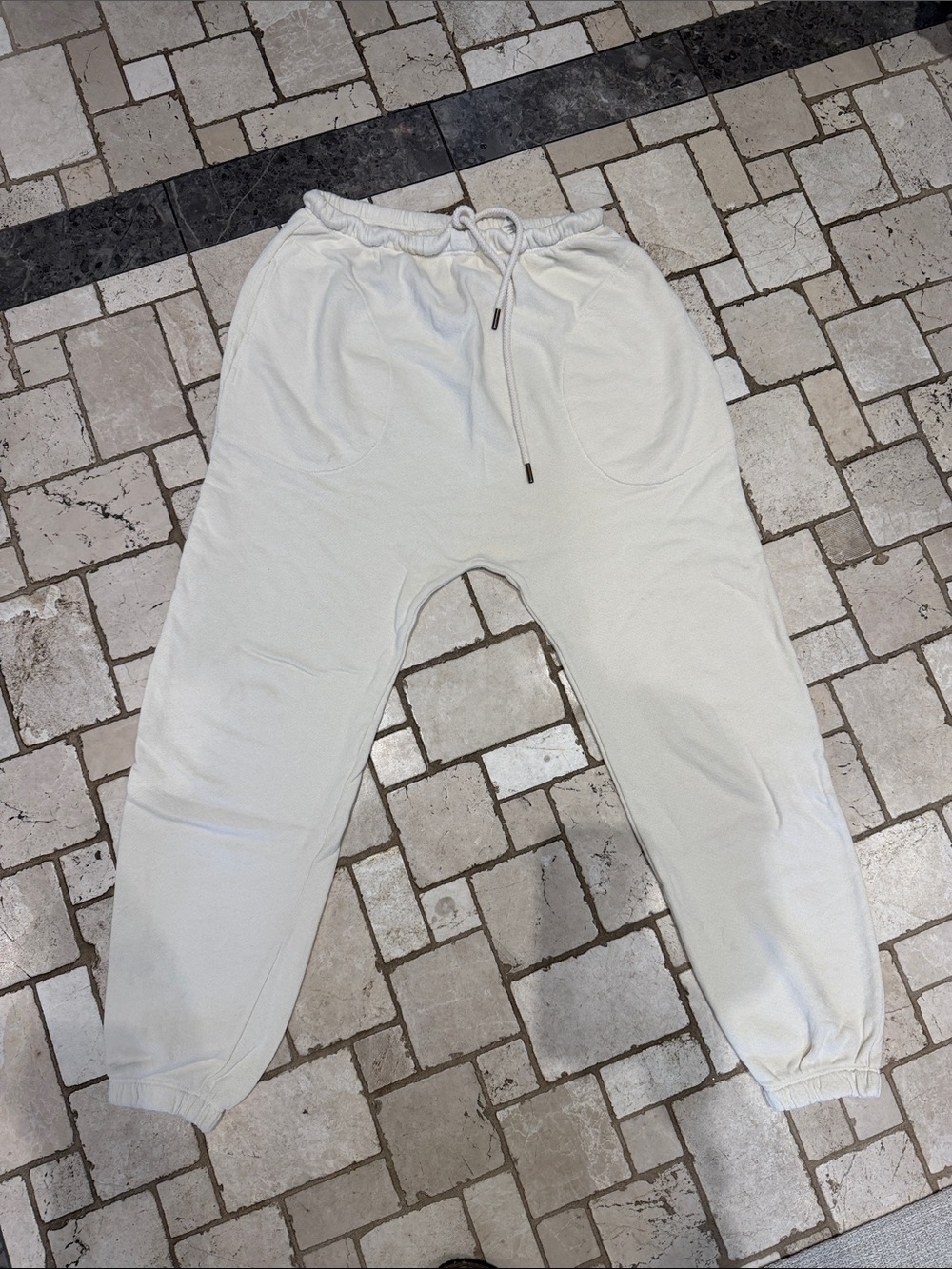 THE GREAT. Off-White/Light Cream Drawstring Joggers. Drop crotch. Cuffed bottom